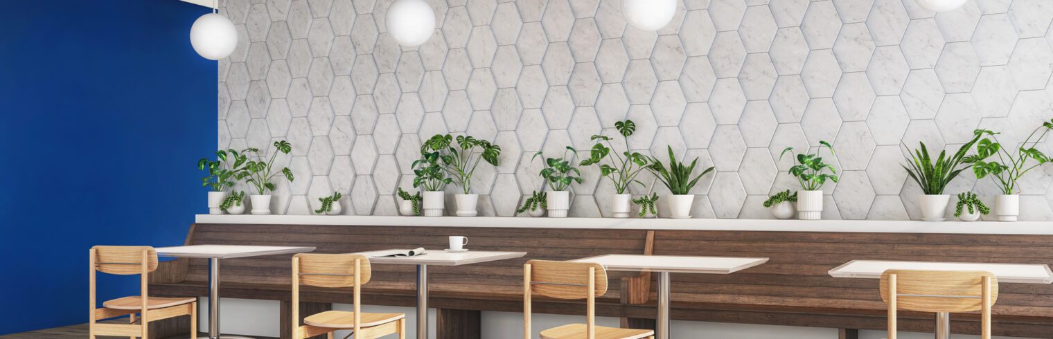 Modern café features a wall of dimensional tiles in a faux marble finish.