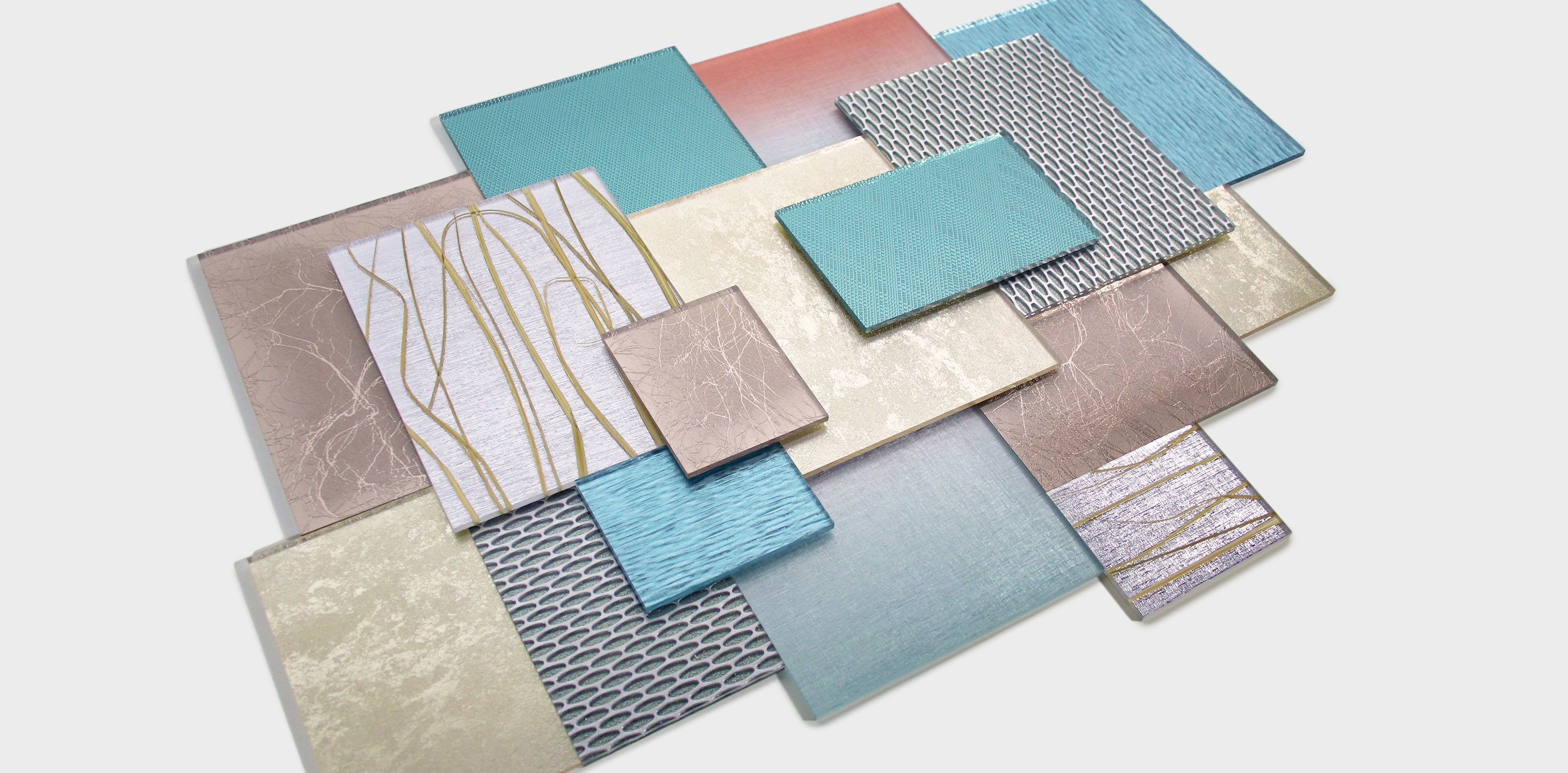 Resin Panel samples are layered on top of each other, showing how Reflective Finishes add-ons pair with décors in various categories.