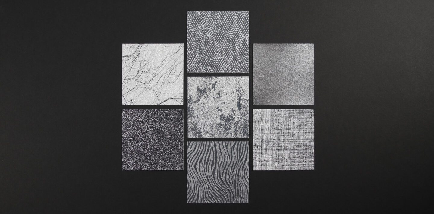 Seven samples of differently textured Reflective Finishes on a black background.