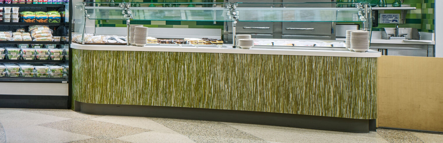 Foodcourt counter clad in naturally-inspired wall protection.