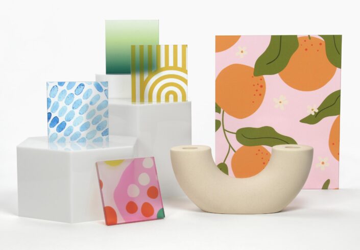 Four smaller square-shaped art panel samples and one large rectangular art panel sample are displayed with geometric objects.